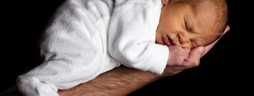 Baby sleeping on a hand